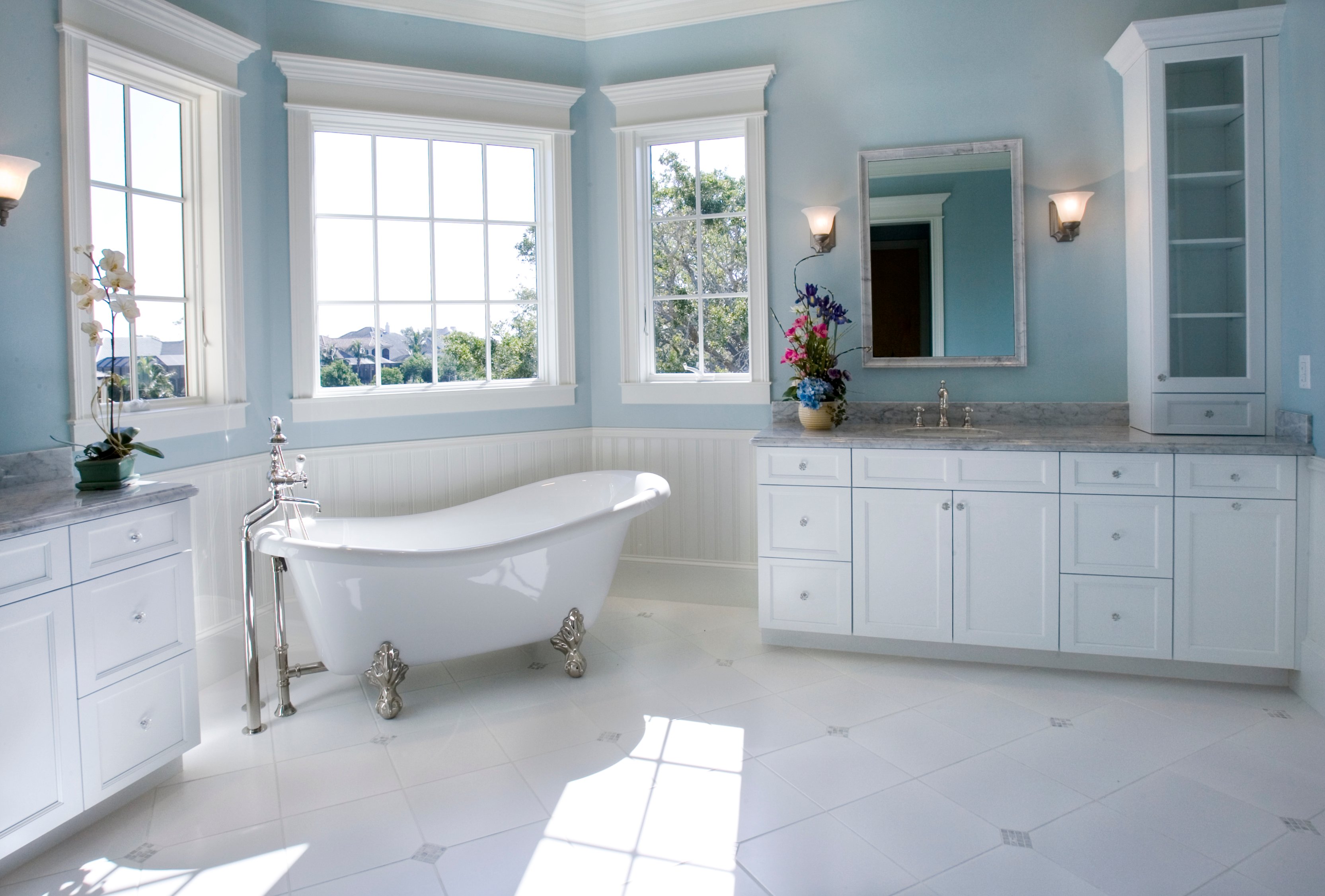 Rustic white and baby blue bathroom with freestanding tub and double vanity